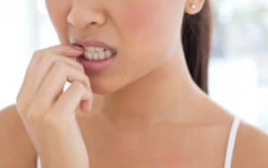 How Biting Your Nails Causes Crooked Teeth